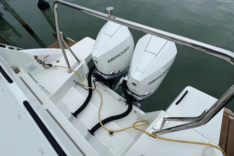  Yacht Photos Pics 2024 Beneteau Flyer 9 SUNdeck with dual Mercury outboard engines at dock.