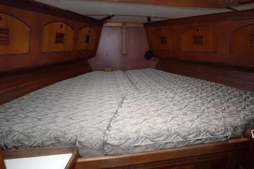  Yacht Photos Pics 1984 Little Harbor LH44 yacht interior with spacious wooden cabin and comfortable bedding.
