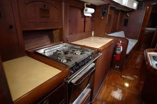  Yacht Photos Pics 1984 Little Harbor LH44 yacht kitchen with wooden cabinetry and gas stove.