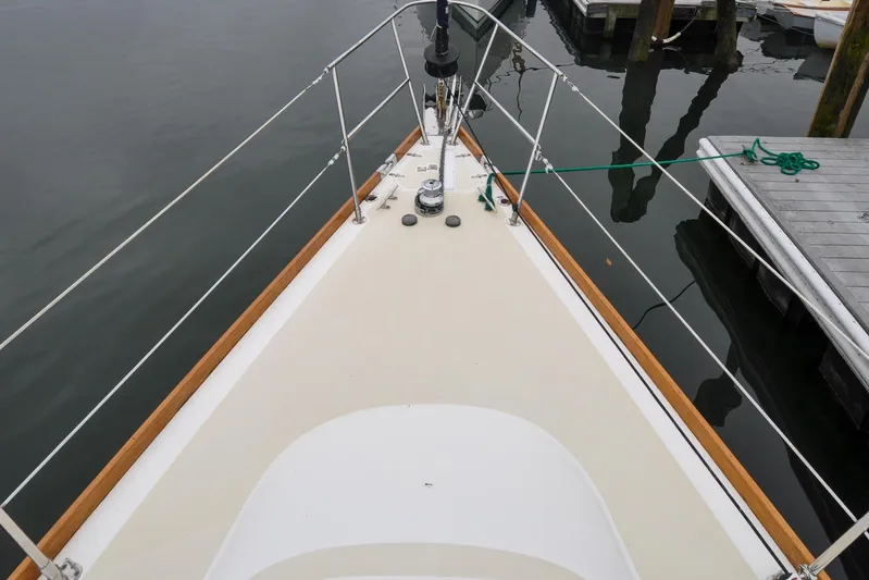 Jezebel Yacht Photos Pics Bow view of 2004 Sabre 426 sailboat docked, featuring clean deck and railing.