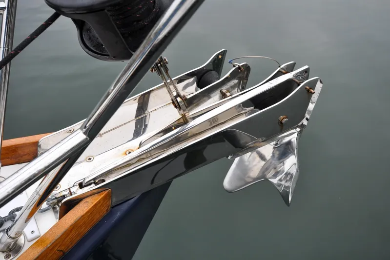 Jezebel Yacht Photos Pics Bow anchor of 2004 Sabre 426 yacht, featuring polished metal and wooden accents.