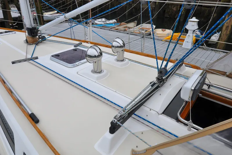 Jezebel Yacht Photos Pics 2004 Sabre 426 sailboat deck with rigging and hatch, docked at marina.