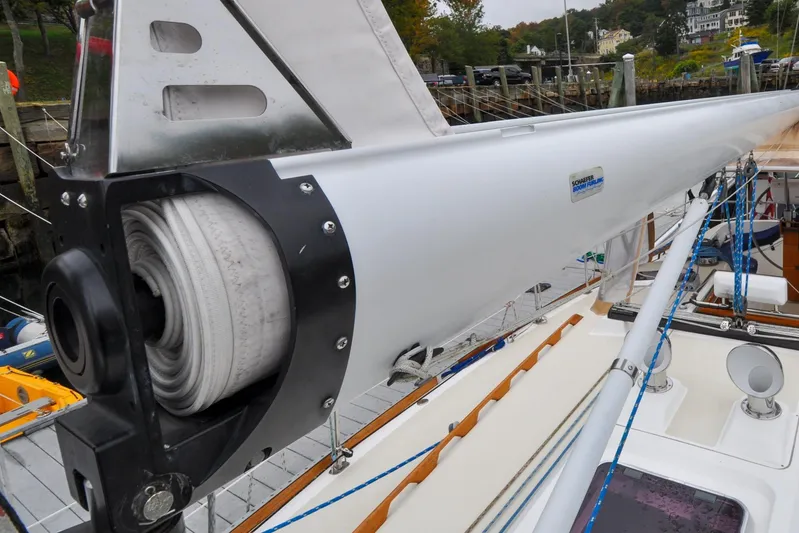 Jezebel Yacht Photos Pics Close-up of a 2004 Sabre 426 sailboat mast with rolled sail and rigging.