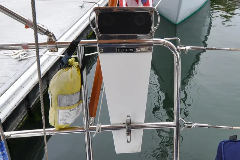 Jezebel Yacht Photos Pics Sailboat stern with safety equipment, Sabre 426, 2004 model, docked at marina.