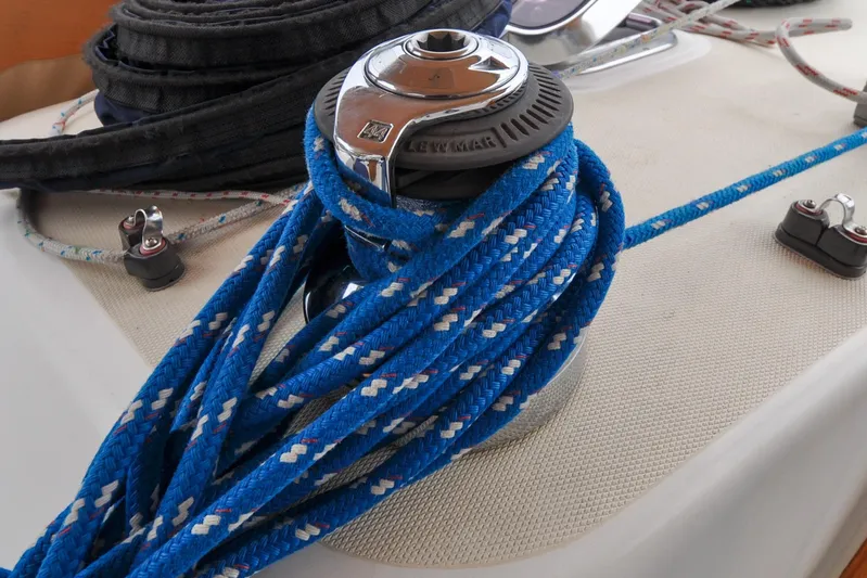 Jezebel Yacht Photos Pics Blue rope coiled on a winch aboard a 2004 Sabre 426 sailboat.
