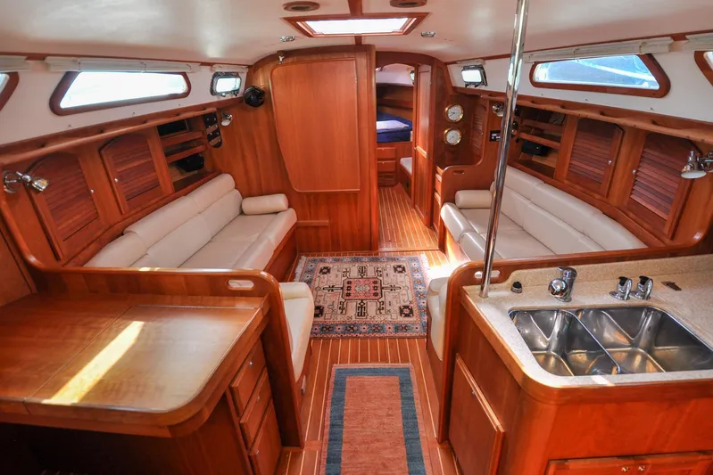 Jezebel Yacht Photos Pics Luxurious interior of 2004 Sabre 426 yacht with wood finish and modern amenities.