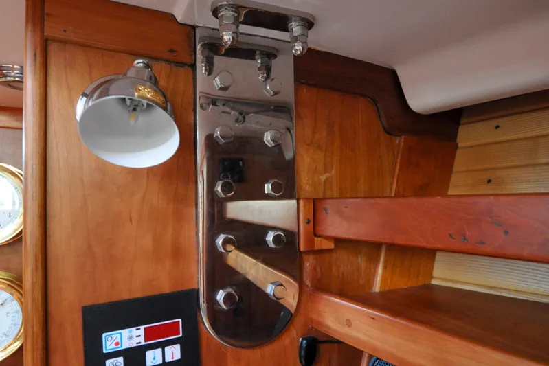 Jezebel Yacht Photos Pics Interior of 2004 Sabre 426 yacht with wooden finish and chrome fixtures.