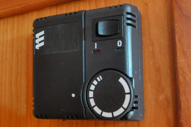 Jezebel Yacht Photos Pics Black control panel with dial and switch, Sabre 426 model, 2004, mounted on wooden surface.