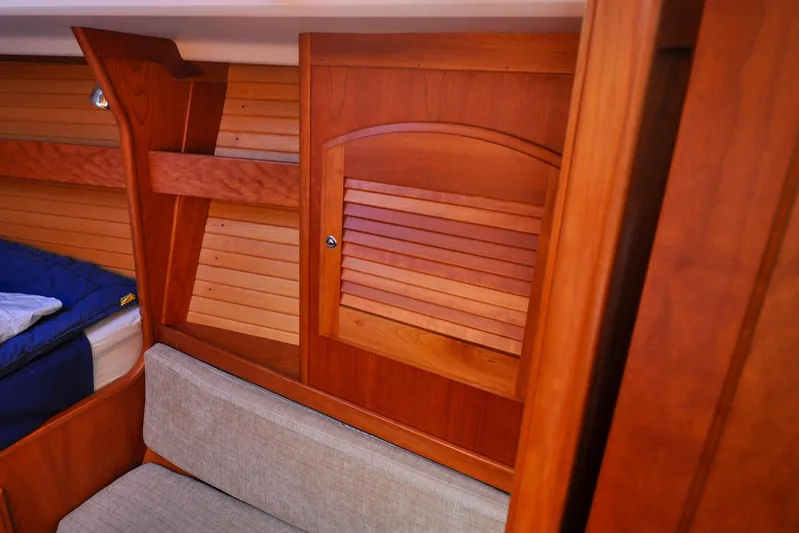 Jezebel Yacht Photos Pics Interior of 2004 Sabre 426 yacht with wooden paneling and seating area.
