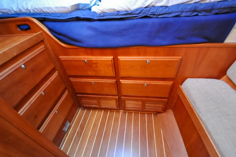 Jezebel Yacht Photos Pics Wooden cabinetry and flooring in 2004 Sabre 426 interior, featuring ample storage space.