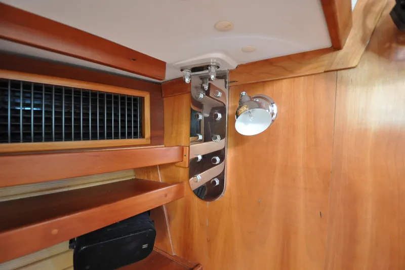 Jezebel Yacht Photos Pics Interior of 2004 Sabre 426 yacht with wooden paneling and metal fixtures.