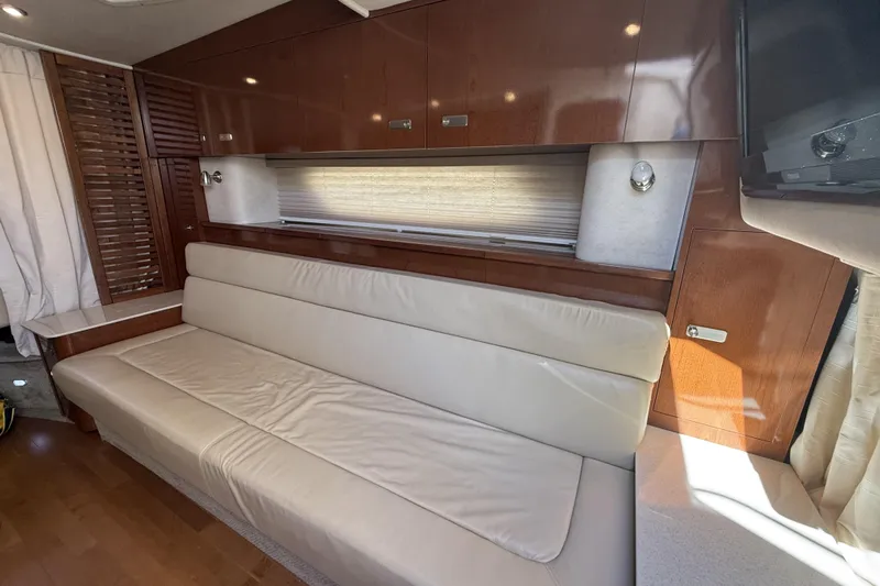  Yacht Photos Pics Interior of 2011 Sea Ray 370 Sundancer with leather seating and wooden cabinetry.