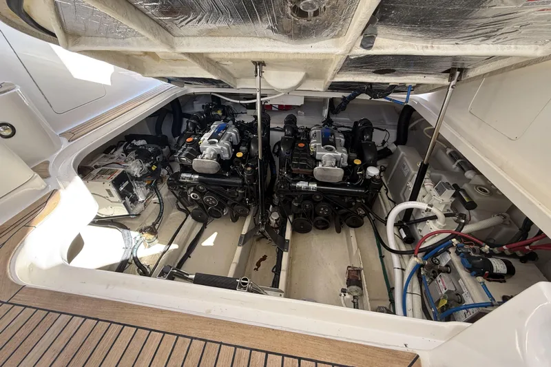  Yacht Photos Pics Engine compartment of a 2011 Sea Ray 370 Sundancer, showcasing dual engines and mechanical components.