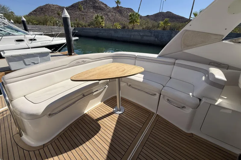  Yacht Photos Pics 2011 Sea Ray 370 Sundancer yacht with elegant seating and wooden table on deck.