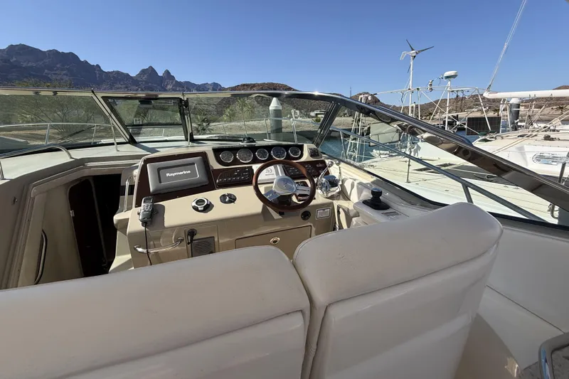  Yacht Photos Pics 2011 Sea Ray 370 Sundancer helm with modern controls and scenic marina backdrop.