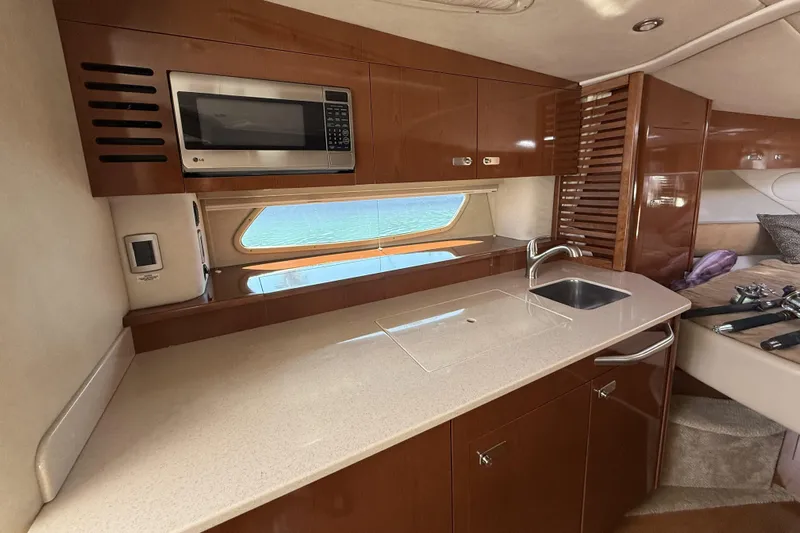  Yacht Photos Pics 2011 Sea Ray 370 Sundancer yacht interior with modern kitchen, microwave, and sink.