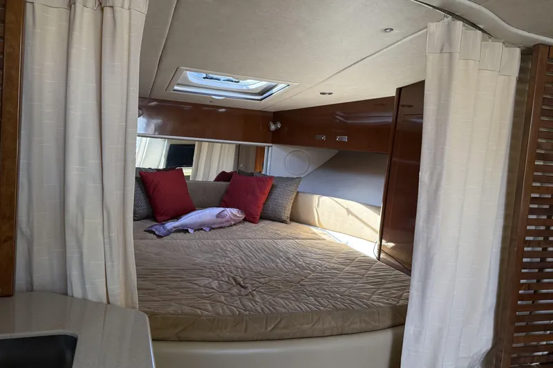  Yacht Photos Pics Interior cabin of 2011 Sea Ray 370 Sundancer with bed and skylight.