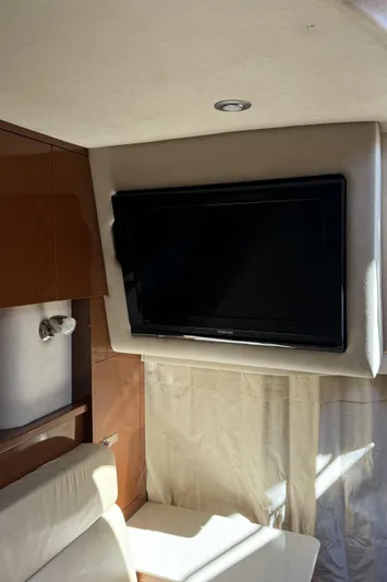  Yacht Photos Pics Interior of 2011 Sea Ray 370 Sundancer with mounted TV and seating area.