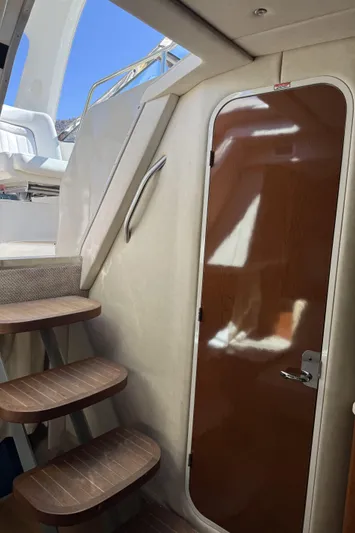  Yacht Photos Pics Interior view of 2011 Sea Ray 370 Sundancer with wooden door and stairs.