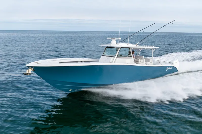  Yacht Photos Pics 2024 Yellowfin 42 boat cruising on open water.