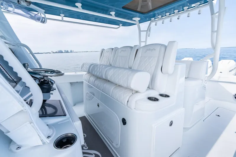  Yacht Photos Pics 2024 Yellowfin 42 boat interior with luxurious white seating and ocean view.
