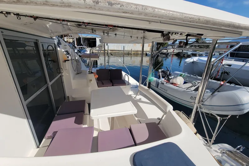 Finding Anemoi Yacht Photos Pics 2014 Leopard 39 yacht cockpit with seating and table, docked at marina.