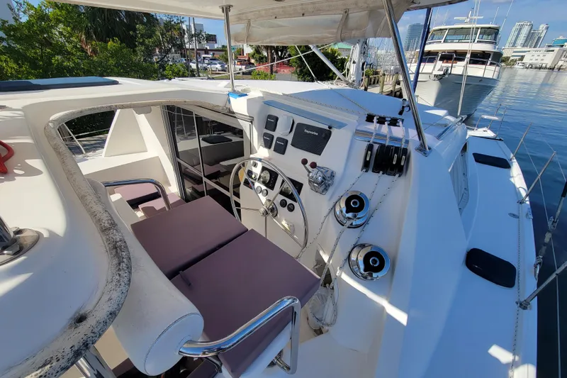 Finding Anemoi Yacht Photos Pics Cockpit of 2014 Leopard 39 catamaran with steering wheel and navigation controls.