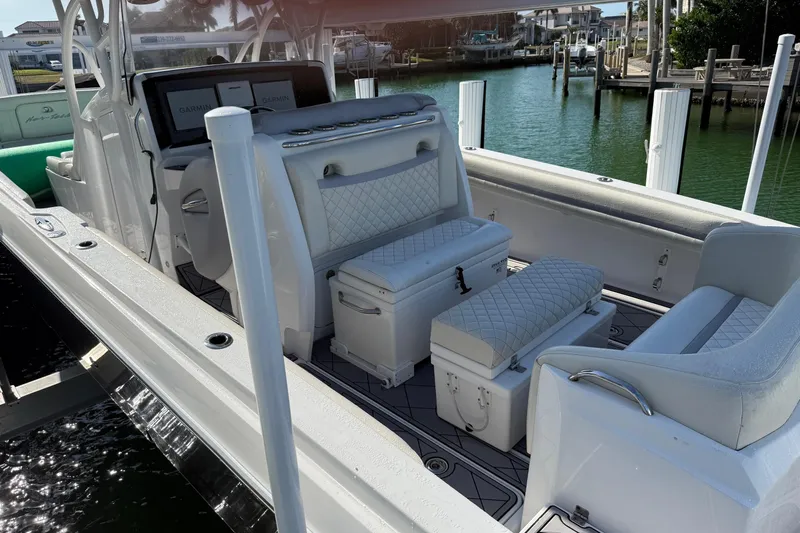  Yacht Photos Pics 2014 Nor-Tech 340 Sport Center Console boat interior with white seating and Garmin displays.
