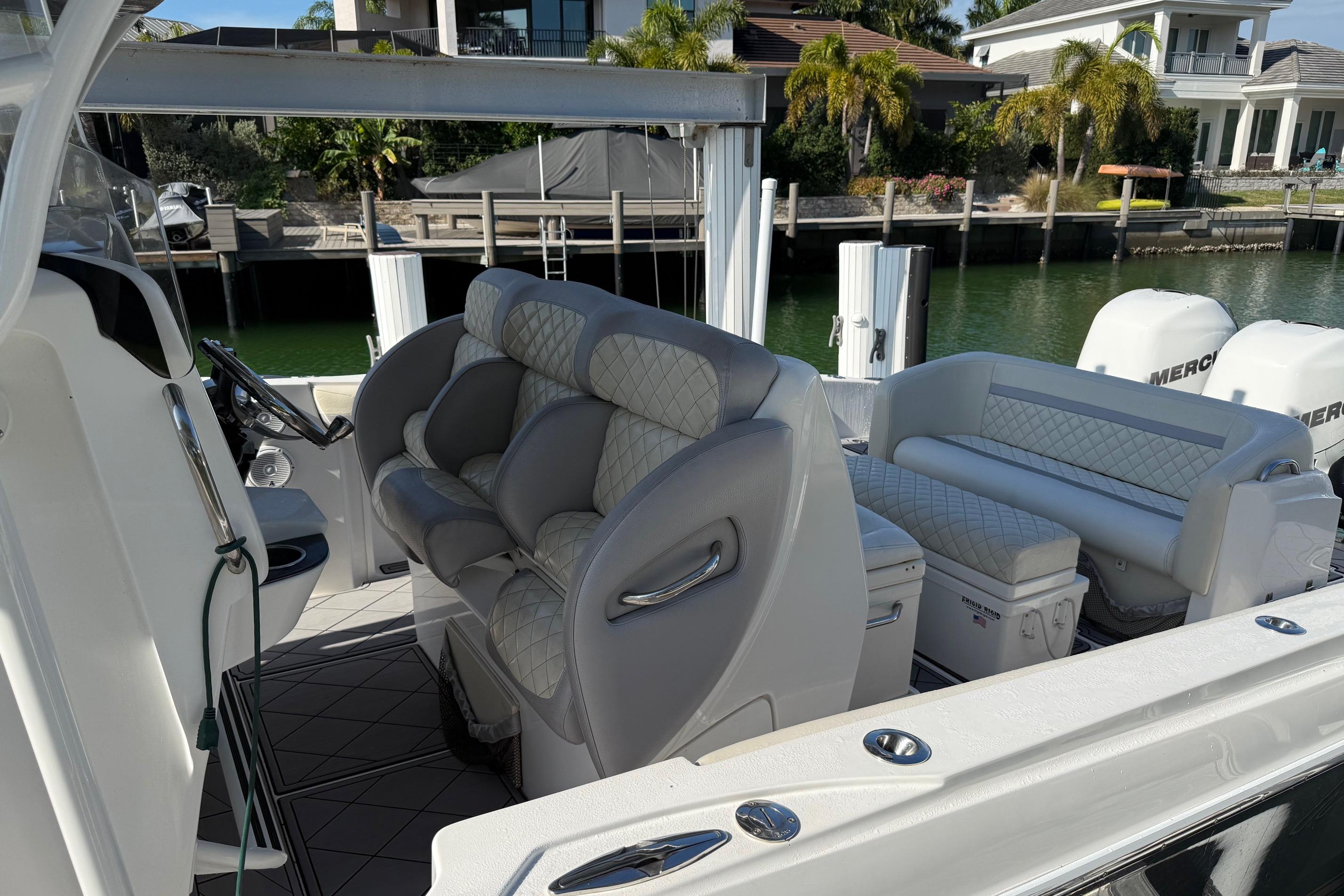 2014 Nor-Tech 340 Sport Center Console boat with luxurious seating and modern design.