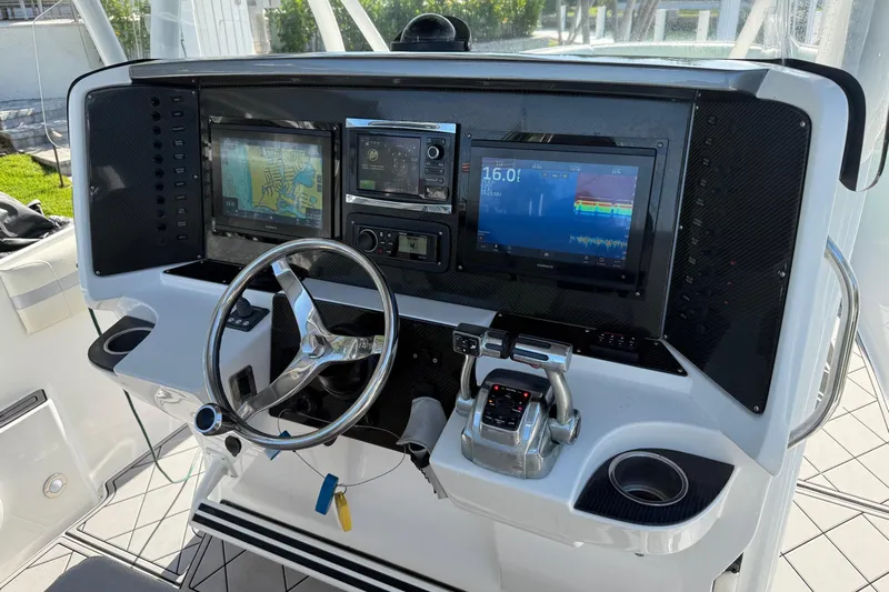  Yacht Photos Pics 2014 Nor-Tech 340 Sport Center Console dashboard with navigation and control systems.