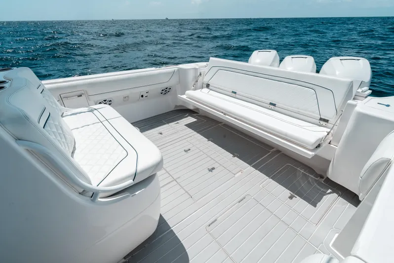  Yacht Photos Pics 2022 Intrepid 407 Nomad FE boat interior with seating, ocean view.