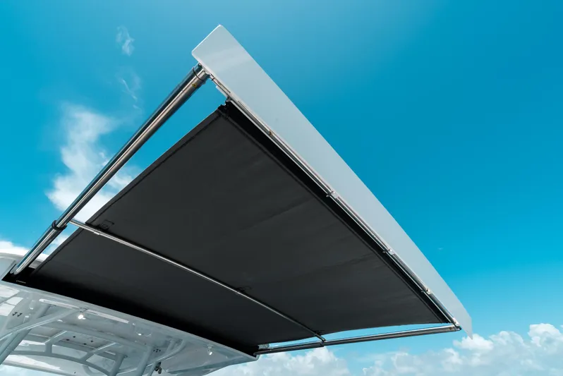  Yacht Photos Pics 2022 Intrepid 407 Nomad FE boat canopy against a clear blue sky.