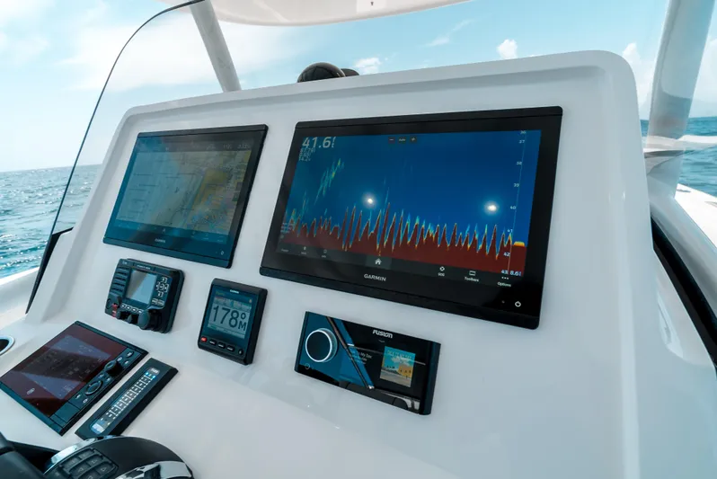  Yacht Photos Pics Dashboard of 2022 Intrepid 407 Nomad FE with advanced navigation displays.