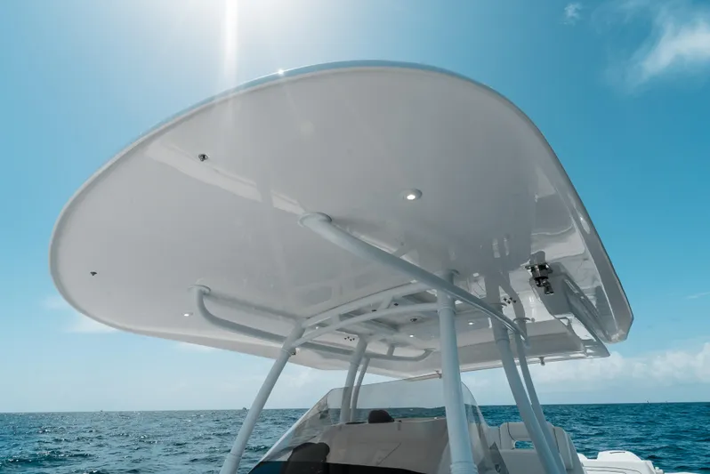  Yacht Photos Pics 2022 Intrepid 407 Nomad FE boat canopy under clear blue sky.