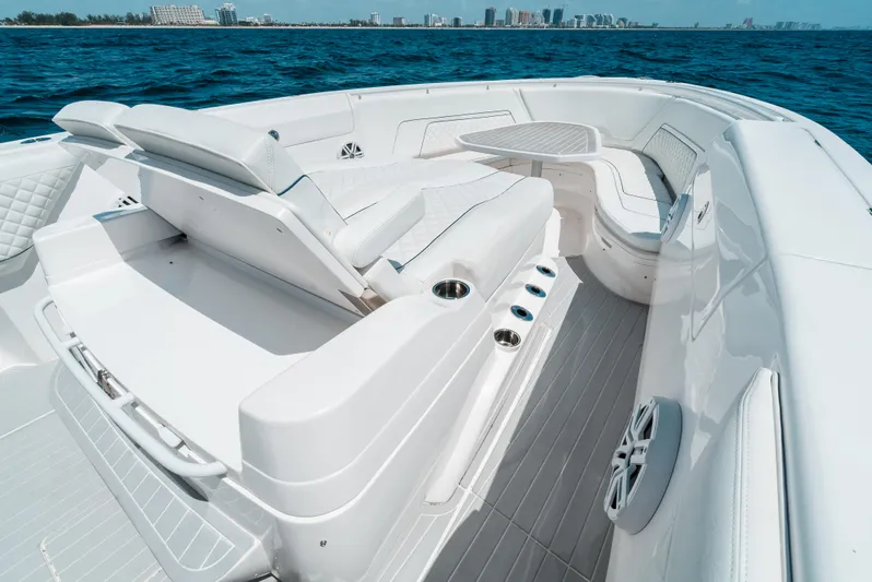  Yacht Photos Pics 2022 Intrepid 407 Nomad FE boat interior with luxurious seating and ocean view.