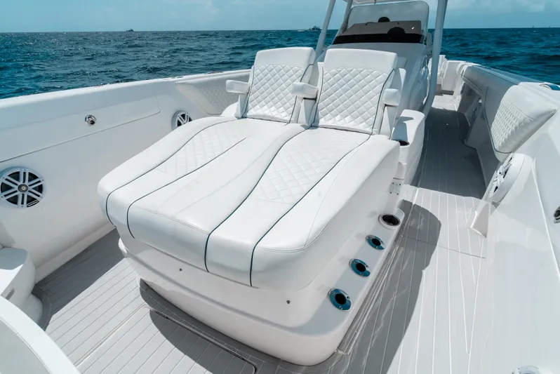  Yacht Photos Pics 2022 Intrepid 407 Nomad FE boat with luxurious white seating on open water.