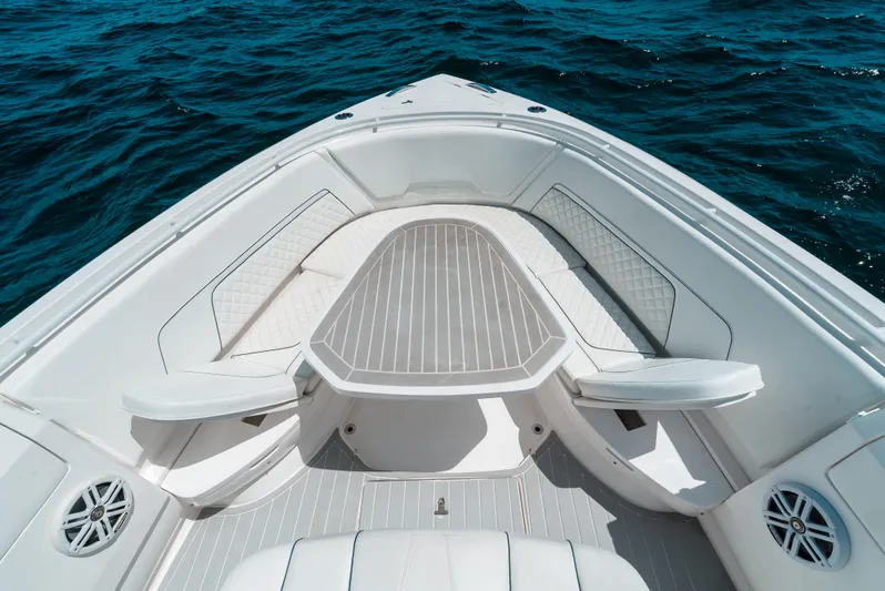  Yacht Photos Pics 2022 Intrepid 407 Nomad FE boat bow with seating, on open water.