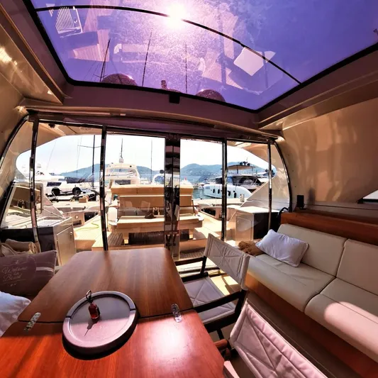 Vida II Yacht Photos Pics Luxurious interior of 2007 Riva 68 Ego yacht with panoramic views and elegant seating.