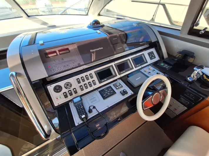 Vida II Yacht Photos Pics Control panel of a 2007 Riva 68 Ego yacht with advanced navigation systems.