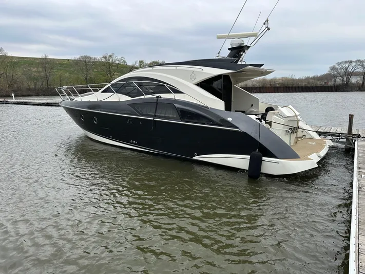  Yacht Photos Pics 2008 Marquis 40 SC yacht docked on calm water, showcasing sleek design and modern features.