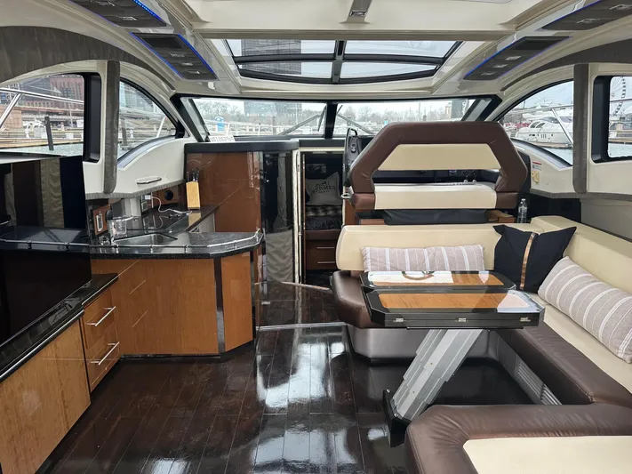  Yacht Photos Pics Luxurious interior of a 2008 Marquis 40 SC yacht with modern kitchen and seating area.