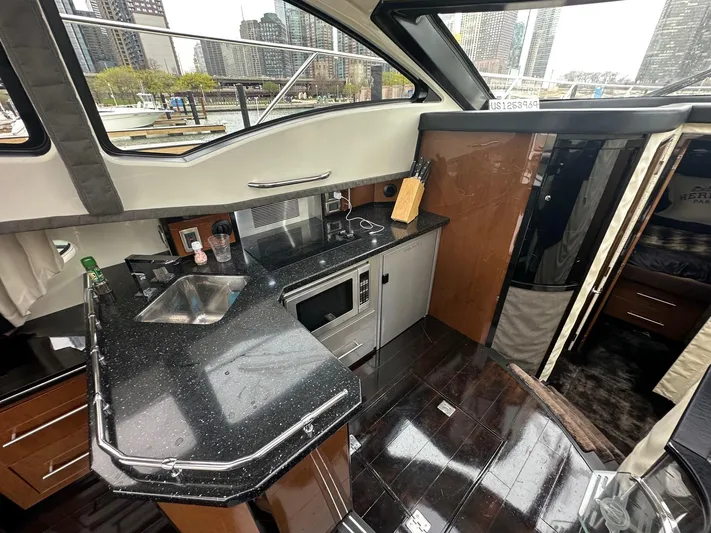  Yacht Photos Pics Interior of a 2008 Marquis 40 SC yacht with modern kitchen amenities.