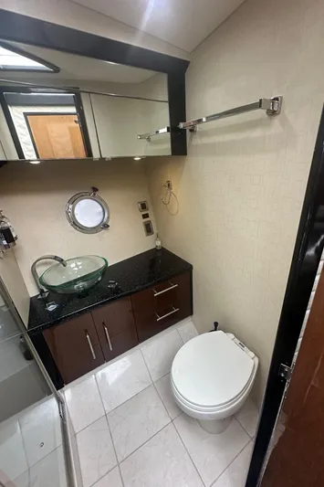  Yacht Photos Pics Luxurious bathroom in 2008 Marquis 40 SC yacht with modern fixtures and elegant design.