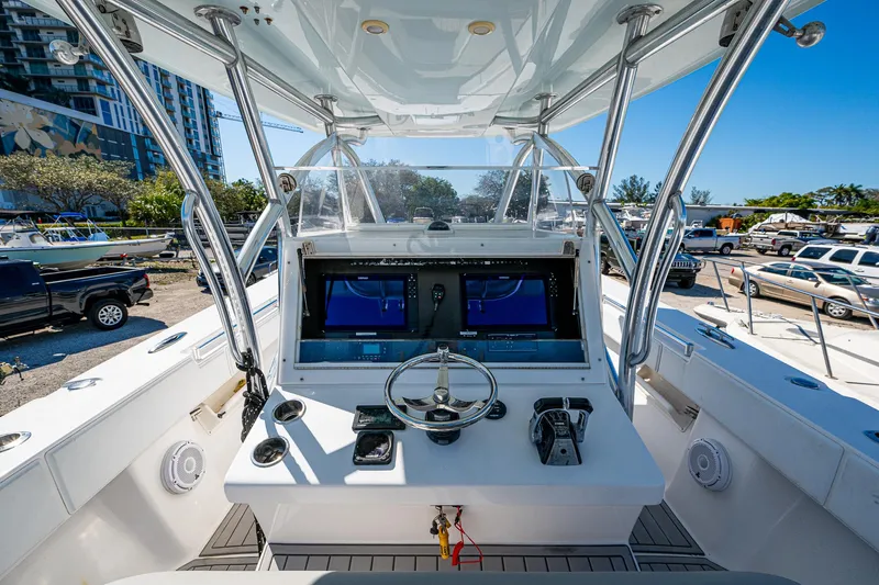  Yacht Photos Pics 2015 SeaHunter 37 Tournament boat cockpit with dual screens and steering wheel.