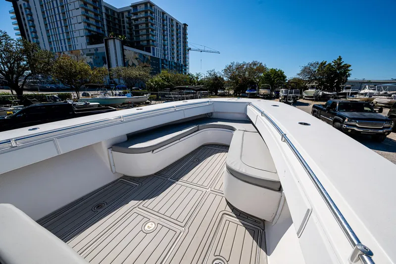  Yacht Photos Pics 2015 SeaHunter 37 Tournament boat with spacious seating, docked near urban buildings.