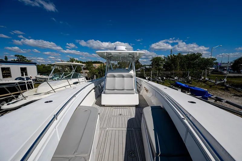  Yacht Photos Pics 2015 SeaHunter 37 Tournament boat with spacious deck and seating under a clear blue sky.