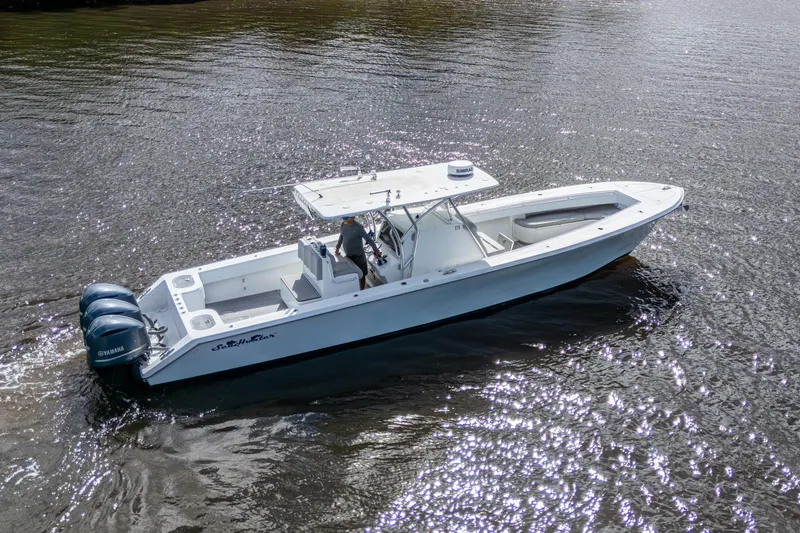  Yacht Photos Pics 2015 SeaHunter 37 Tournament boat on water, featuring triple Yamaha engines.