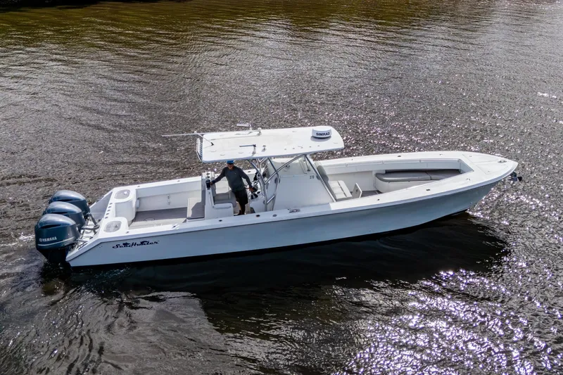  Yacht Photos Pics 2015 SeaHunter 37 Tournament boat on water with triple Yamaha engines.