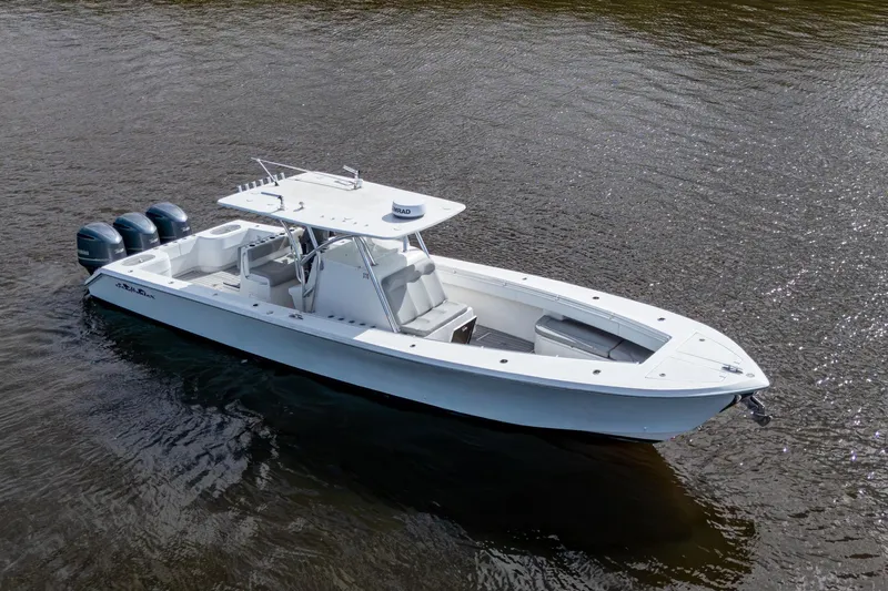  Yacht Photos Pics 2015 SeaHunter 37 Tournament boat with triple outboard engines on calm water.