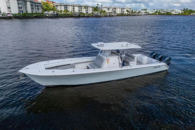  Yacht Photos Pics 2015 SeaHunter 37 Tournament boat on calm water near residential buildings.